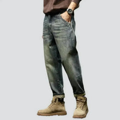 Sanded medium-wash jeans for men