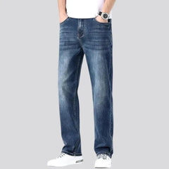 Stonewashed whiskered jeans for men