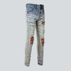 Orange patch knees men's jeans