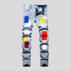 Light-wash color-patches jeans