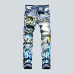 Ripped blue flame print jeans for men