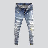 Ripped light men's wash jeans
