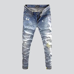 Ripped light men's wash jeans