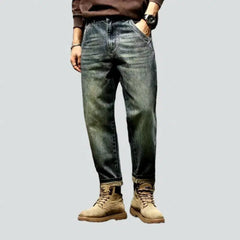 Sanded medium-wash jeans for men