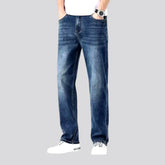 Stonewashed whiskered jeans for men