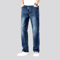 Stonewashed whiskered jeans for men