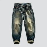 Yellow-cast medium-wash jeans for men