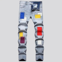 Light-wash color-patches jeans