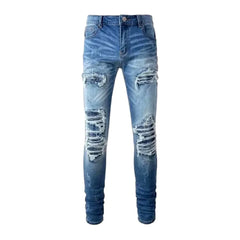 Damaged men's whiskered jeans
