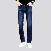 Dark slim-fitting casual men's jeans