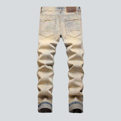 Distressed men's jeans with zippers