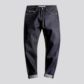 Raw tapered mid rise men's jeans
