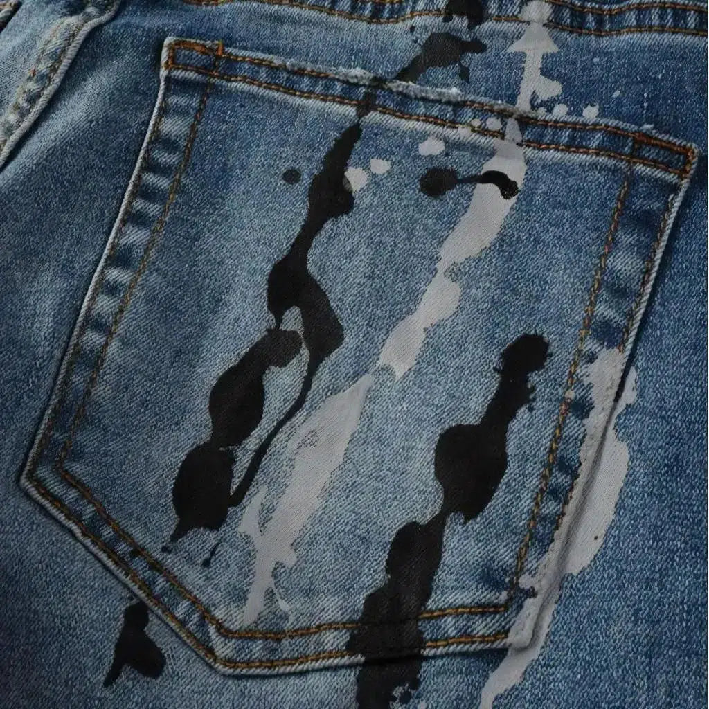 Painted men's light-wash jeans